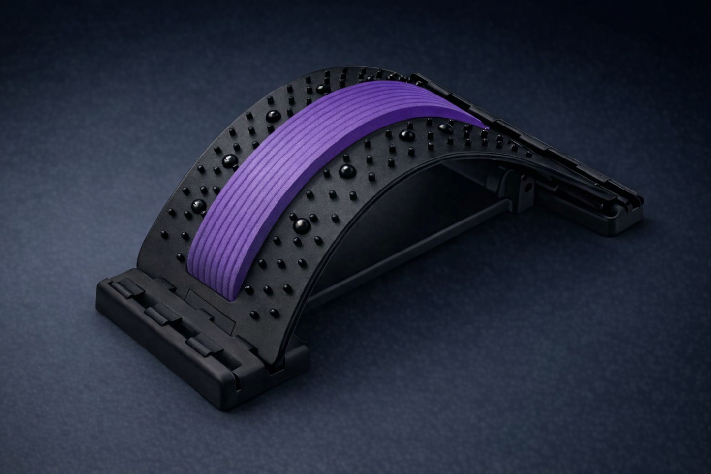 Lumbar decompression back stretcher with acupressure nodes and purple comfort band for posture and mobility support.